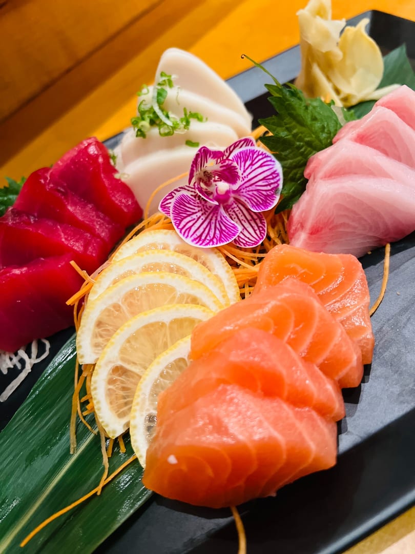 Sashimi platter with salmon, tuna, and yellowtail