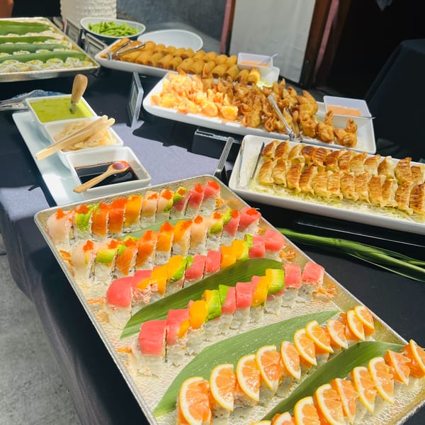 Nigiri and sashimi buffet spread with hamachi and maguro sashimi