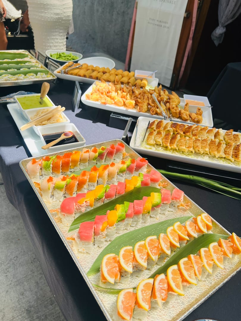 Nigiri and sashimi buffet spread with hamachi and maguro sashimi