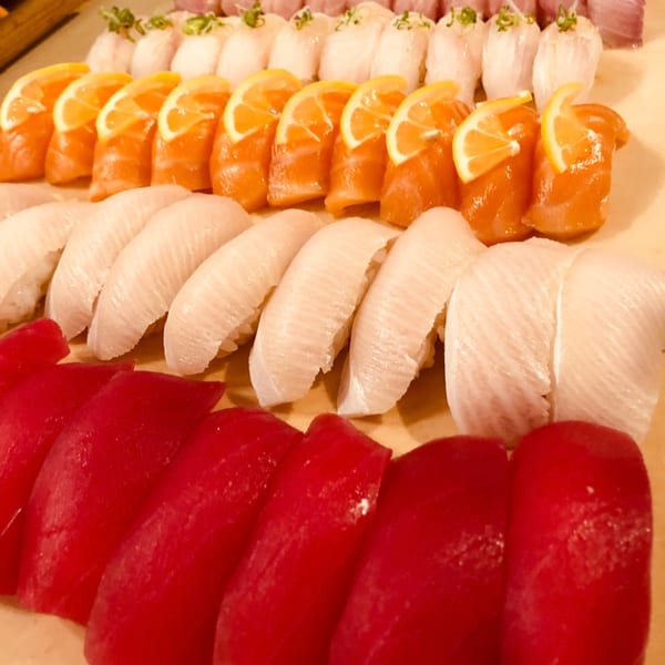 Nigiri board with tuna, salmon, whitefish, and hamachi