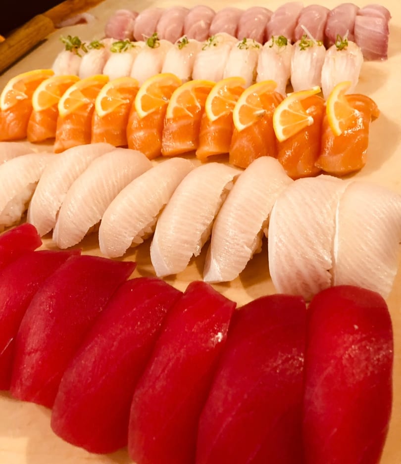 Nigiri board with tuna, salmon, whitefish, and hamachi